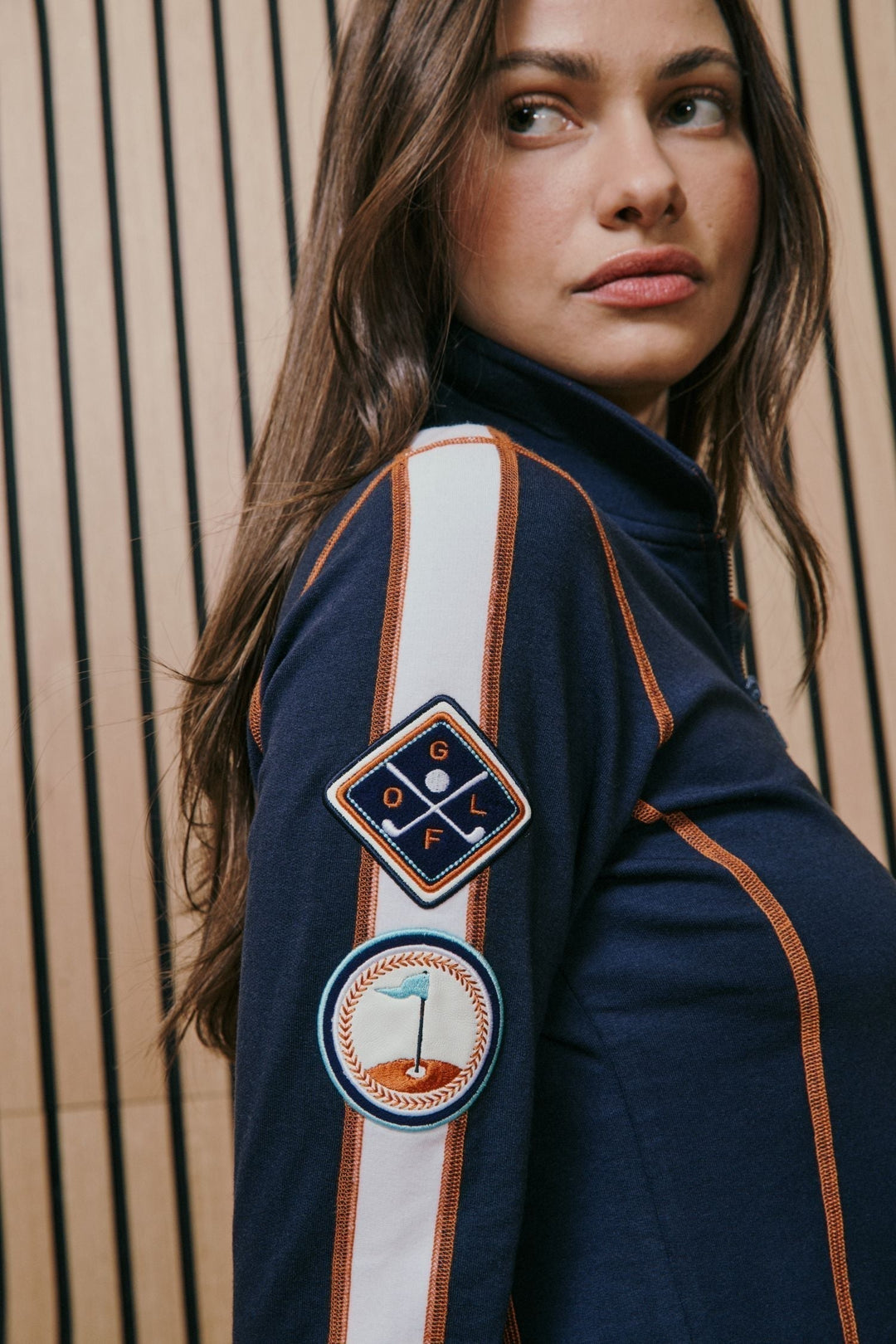 Woman wearing fashionable golf jacket