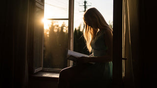 woman reading sunlit