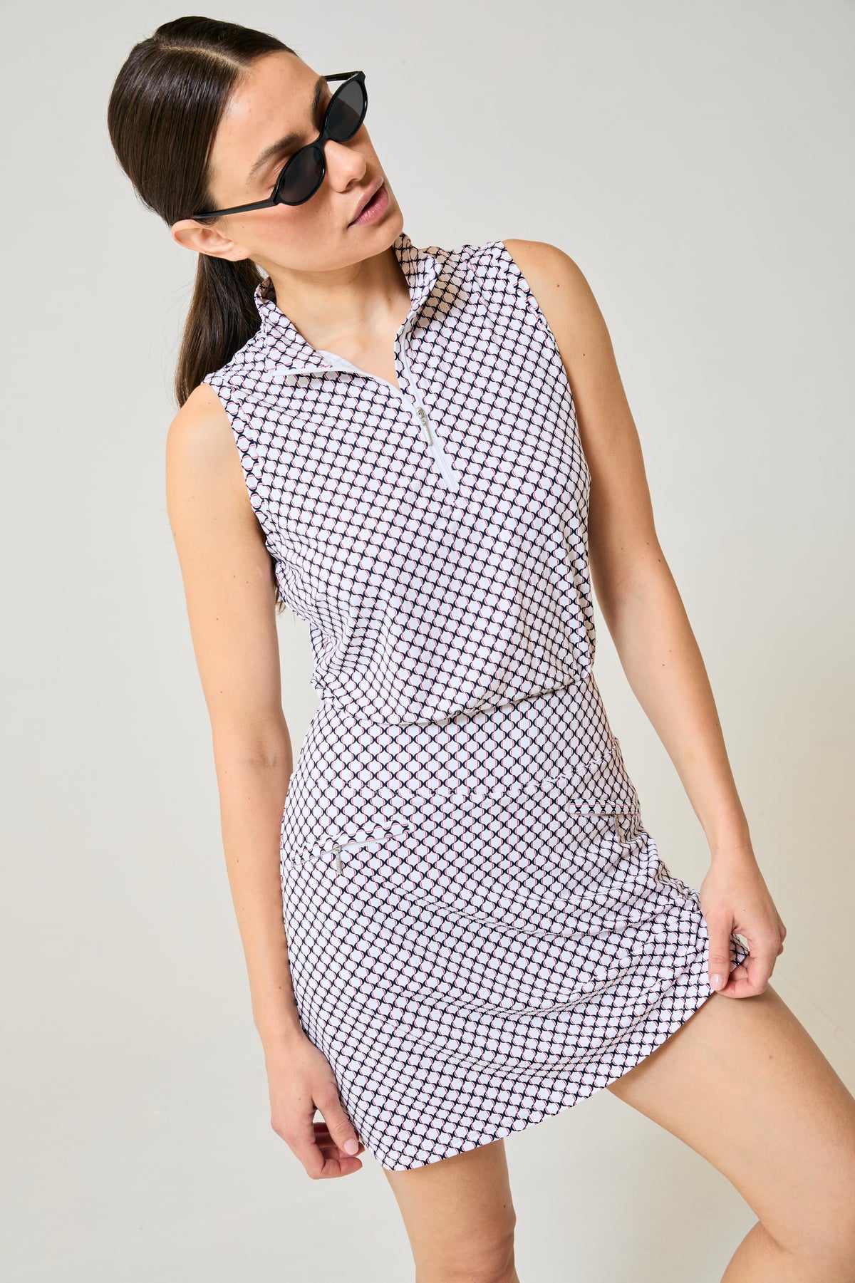 Tess Ice Sleeveless Spirit. White lattice with navy and red. Skort shown is Harlo Spirit, styling only.