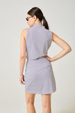 Back view of Tess Ice Sleeveless Spirit. White lattice with navy and red. Skort shown is Harlo Spirit, styling only.